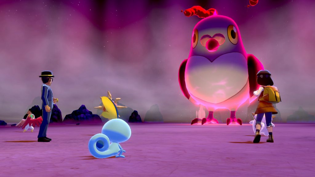 A screenshot from Pokemon Sword featuring several normal-sized Trainers facing an enormous Pidove.